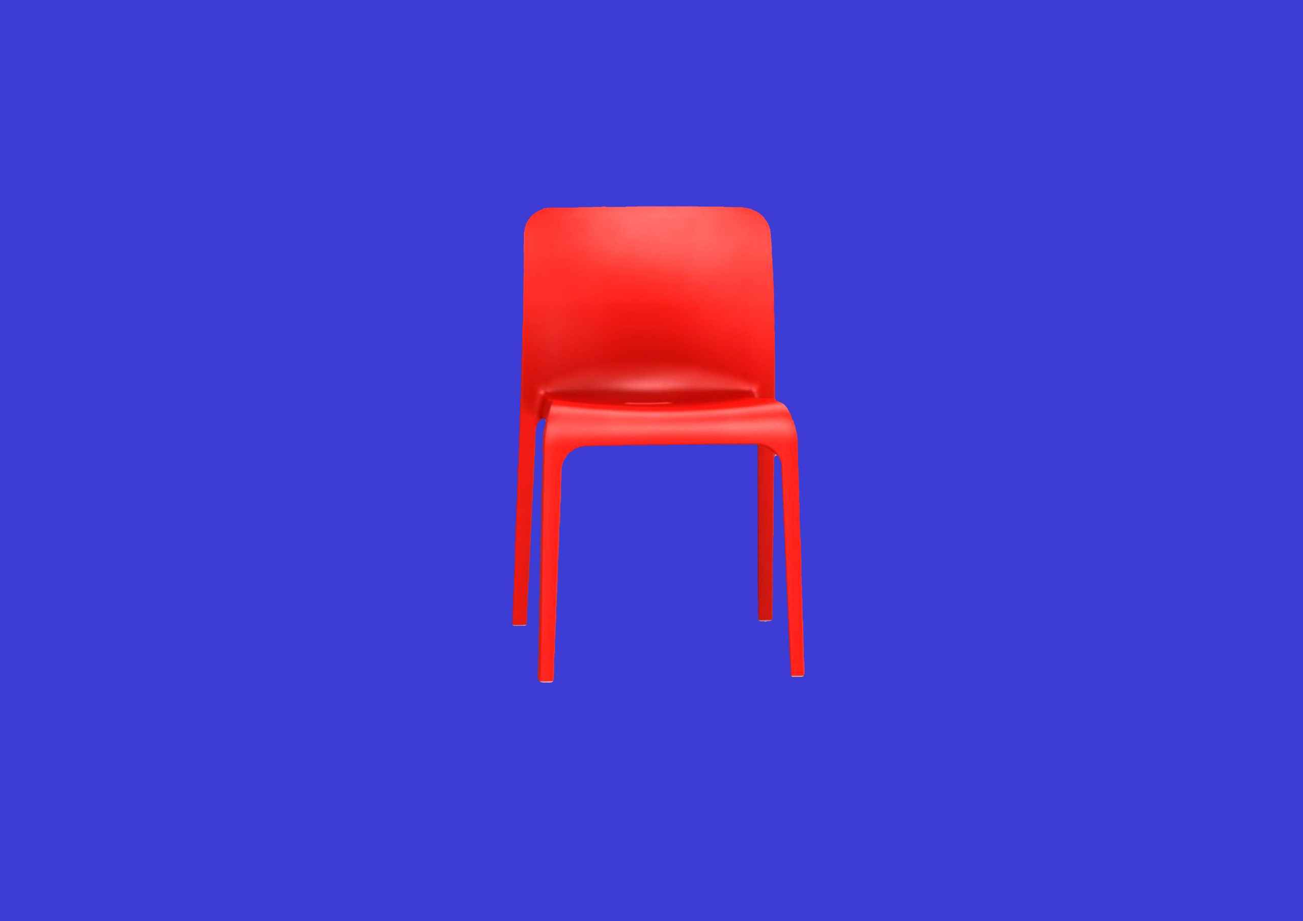 A red chair against a blue background.